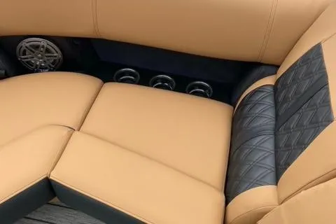 Slide: The Image of 2022 Harris Solstice 230 boat interior with tan and black quilted seating. - 26