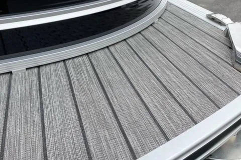 Slide: The Image of Close-up of 2022 Harris Solstice 230 boat deck with textured gray surface. - 27
