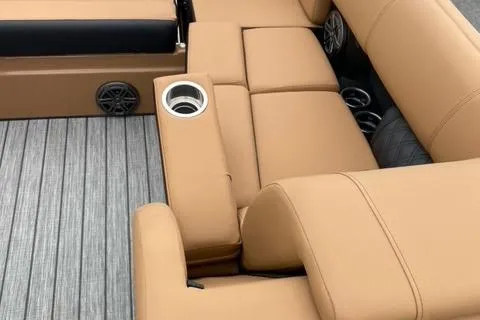 Slide: The Image of 2022 Harris Solstice 230 boat interior with tan seating and cup holders. - 29