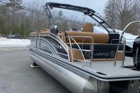 Slide: The Image of 2022 Harris Solstice 230 pontoon boat with sleek design and comfortable seating. - 6