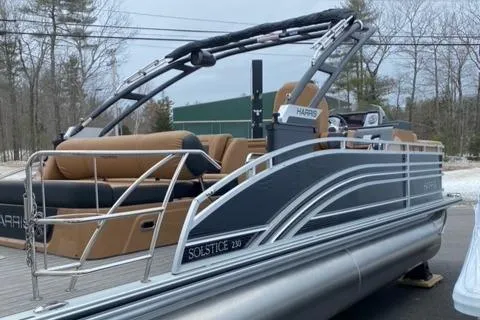 Slide: The Image of 2022 Harris Solstice 230 pontoon boat with sleek design and comfortable seating. - 7