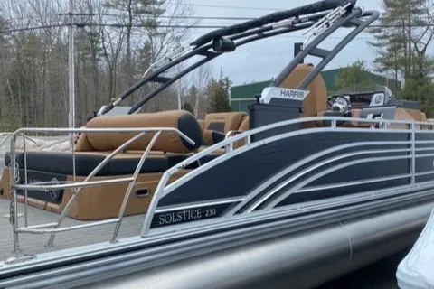 Slide: The Image of 2022 Harris Solstice 230 pontoon boat with sleek design and comfortable seating. - 8
