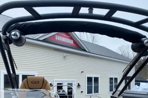 Slide: The Image of 2022 Harris Solstice 230 boat displayed outside a showroom. - 9