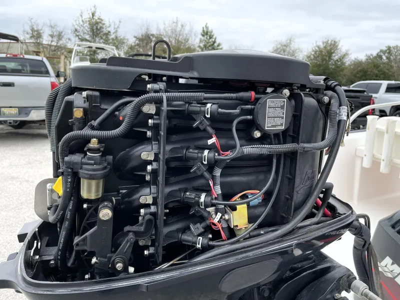 Slide: The Image of 2003 Boston Whaler 150 Sport engine, detailed view of internal components. - 17