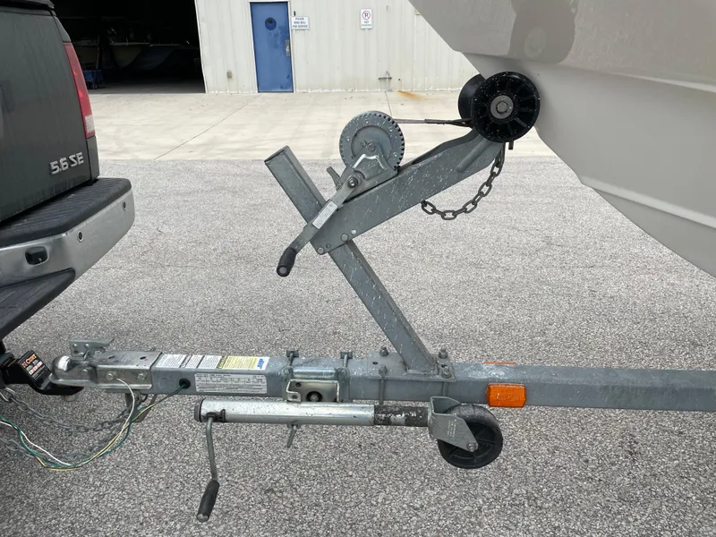 Slide: The Image of Trailer hitch of a 2003 Boston Whaler 150 Sport boat attached to a vehicle. - 20