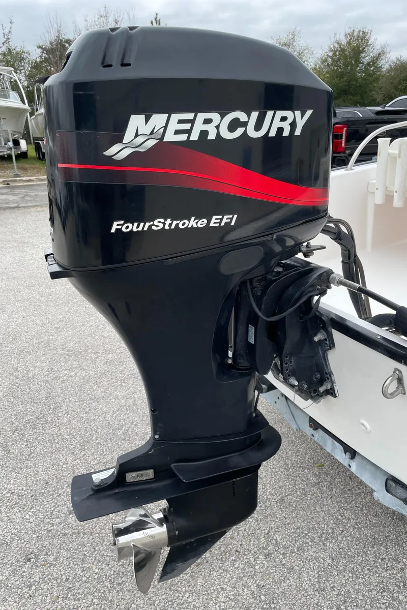 Slide: The Image of Mercury FourStroke EFI outboard motor on 2003 Boston Whaler 150 Sport boat. - 25