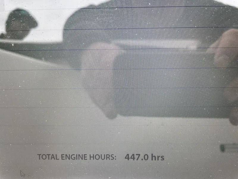 Slide: The Image of 2003 Boston Whaler 150 Sport with 447 engine hours displayed on screen. - 27