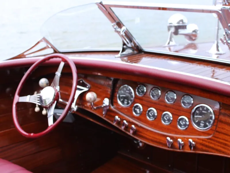 Slide: The Image of Interior of a 2021 Classic Wilson Watercar with vintage wooden dashboard and steering wheel. - 15