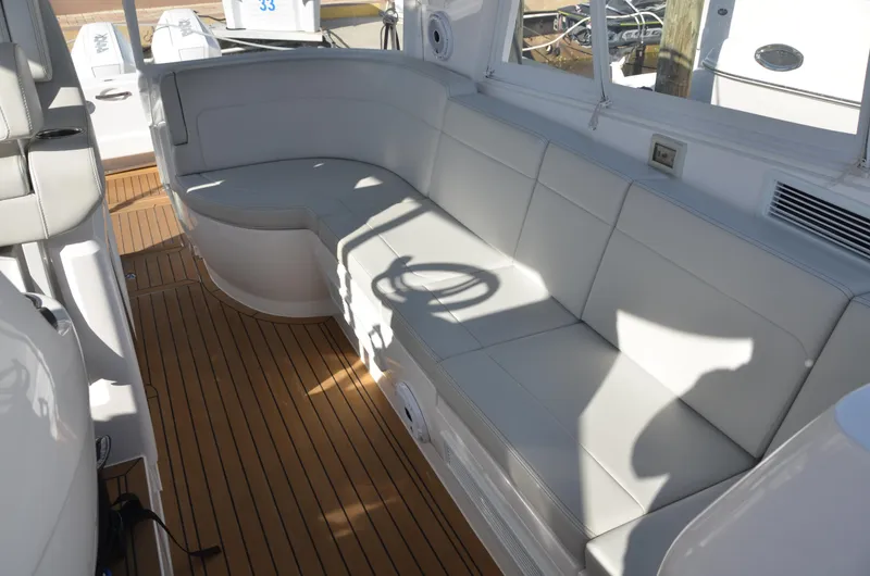 Slide: The Image of Luxurious seating area on 2022 Intrepid 438 Evolution yacht with teak flooring. - 10