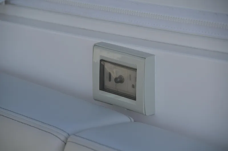 Slide: The Image of Power outlet on 2022 Intrepid 438 Evolution boat interior. - 13