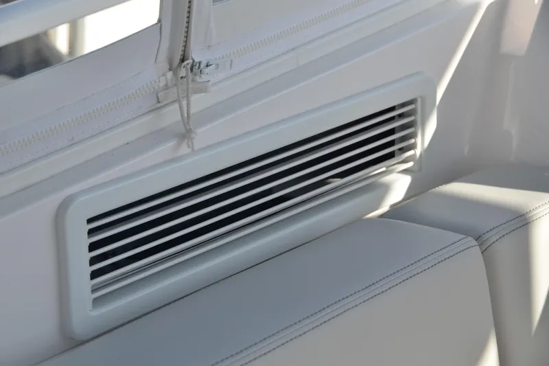 Slide: The Image of Air vent on 2022 Intrepid 438 Evolution boat interior, featuring sleek white design. - 14