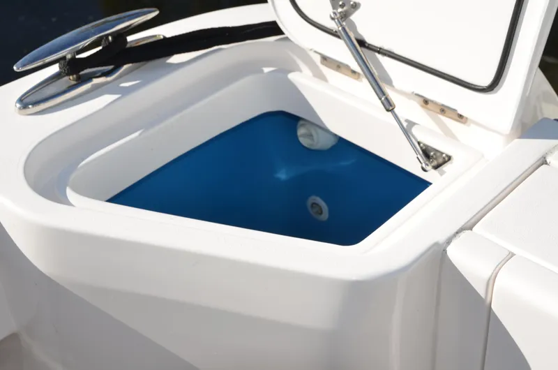 Slide: The Image of Open storage compartment on 2022 Intrepid 438 Evolution boat. - 18