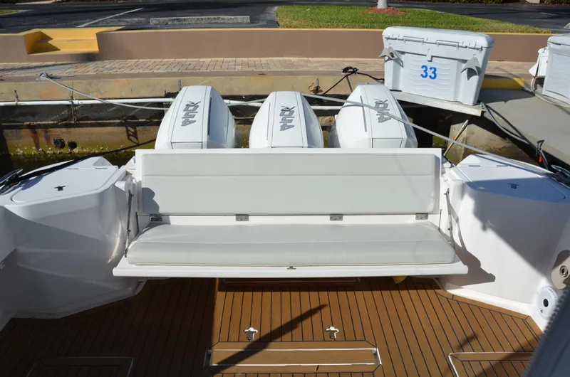 Slide: The Image of 2022 Intrepid 438 Evolution boat with triple outboard engines and spacious seating area. - 20