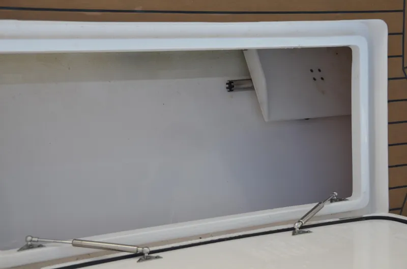 Slide: The Image of Open storage compartment on a 2022 Intrepid 438 Evolution boat. - 22