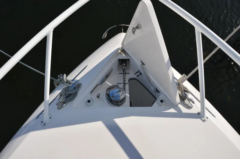Slide: The Image of Bow of 2022 Intrepid 438 Evolution yacht with open anchor hatch. - 23