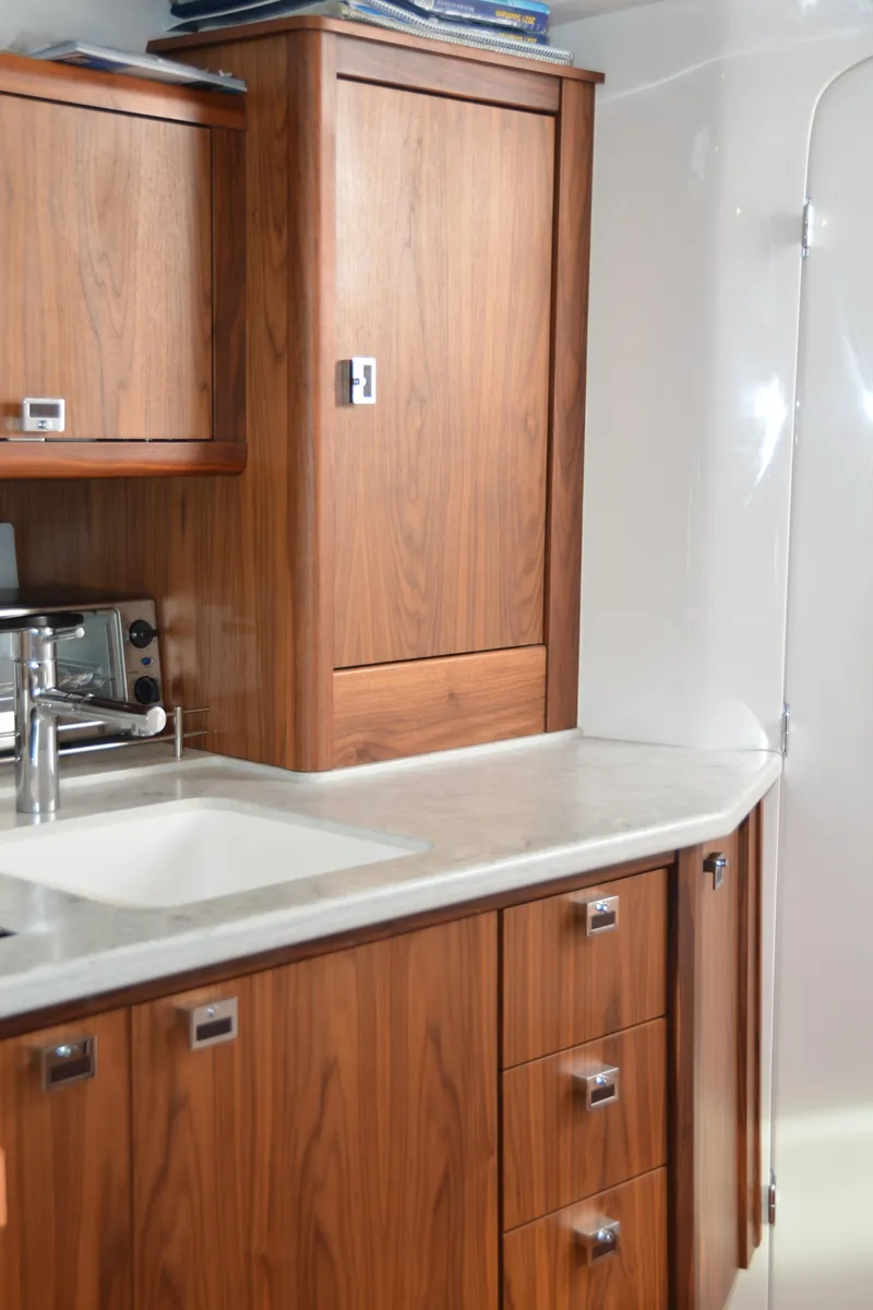 Slide: The Image of Luxurious wooden cabinetry in 2022 Intrepid 438 Evolution yacht kitchen. - 38