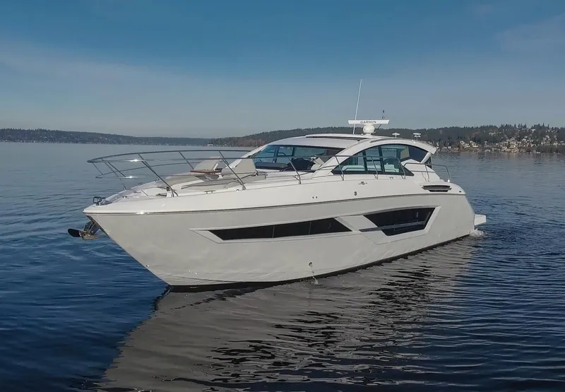 Slide: The Image of 2025 Cruisers Yachts 46 Cantius on calm water, showcasing sleek design and luxury features. - 6