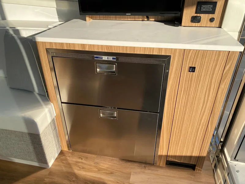 Slide: The Image of Modern kitchen area in 2025 Cruisers Yachts 46 Cantius with stainless steel appliances. - 25