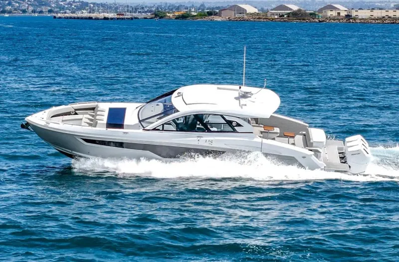 Slide: The Image of 2025 Cruisers Yachts 50 GLS cruising on open water. - 2