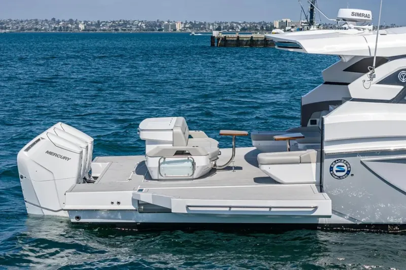 Slide: The Image of 2025 Cruisers Yachts 50 GLS on water, featuring sleek design and powerful Mercury engine. - 8