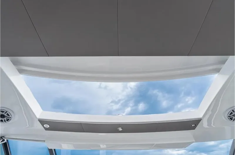 Slide: The Image of 2025 Cruisers Yachts 50 GLS skylight view with blue sky and clouds. - 27