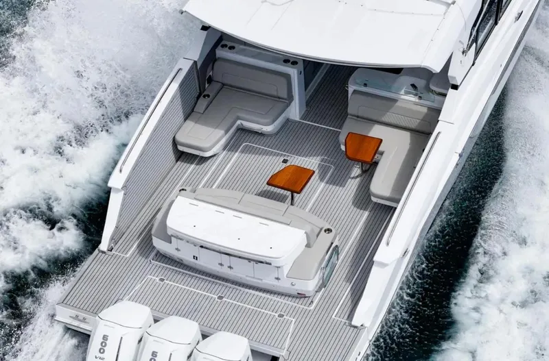 Slide: The Image of 2025 Cruisers Yachts 50 GLS luxury boat with spacious deck and seating. - 4