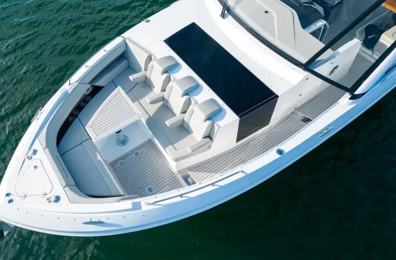 Slide: The Image of 2025 Cruisers Yachts 50 GLS luxury boat with spacious seating on open water. - 46