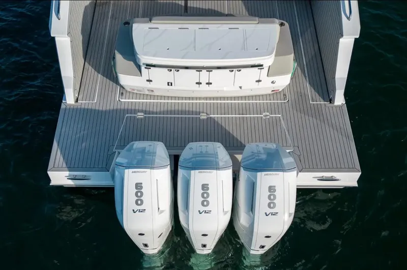 Slide: The Image of 2025 Cruisers Yachts 50 GLS with triple 600 V12 engines on water. - 9