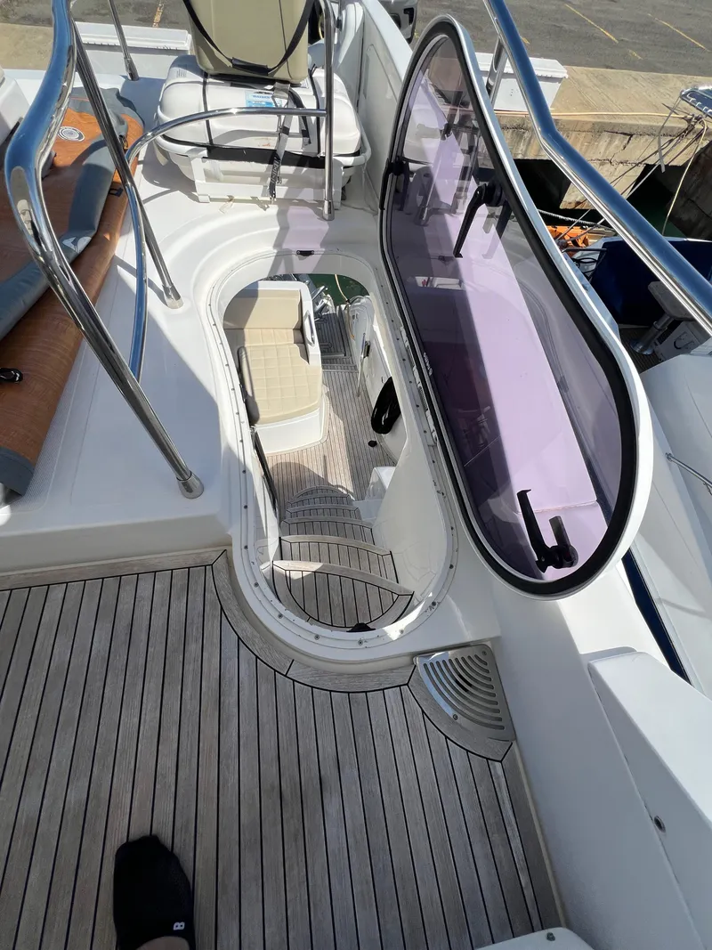 Slide: The Image of Azimut 54fly 2016 yacht deck with open hatch and seating area. - 13