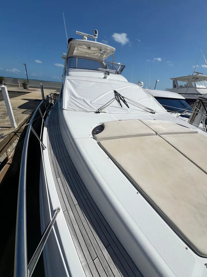 Slide: The Image of 2016 Azimut 54fly yacht docked under clear blue sky. - 23