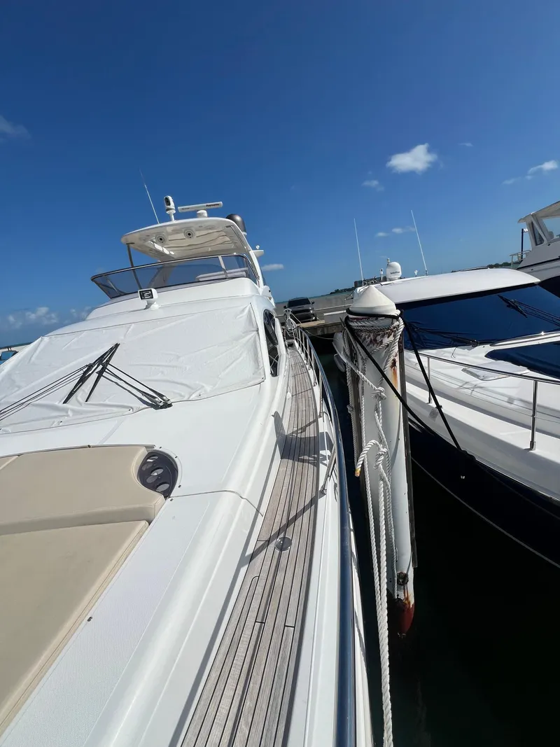 Slide: The Image of Azimut 54fly 2016 yacht docked under clear blue sky. - 24