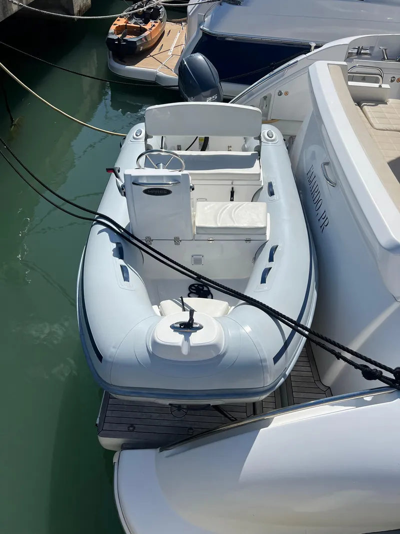 Slide: The Image of 2016 Azimut 54fly yacht with inflatable tender docked in marina. - 28