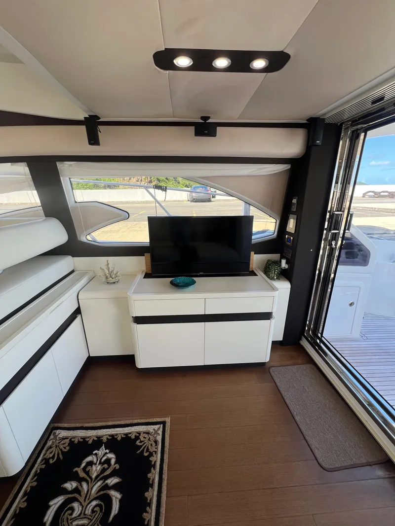 Slide: The Image of Luxurious interior of 2016 Azimut 54fly yacht with modern furnishings and large windows. - 34
