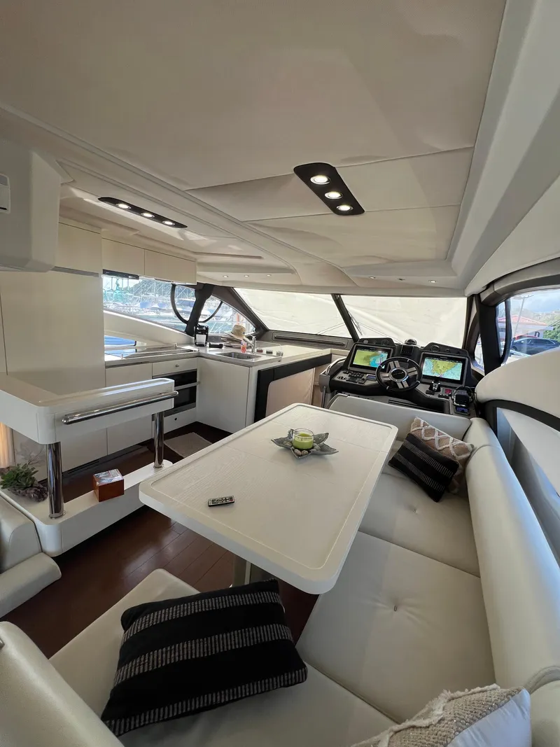 Slide: The Image of Luxurious interior of a 2016 Azimut 54fly yacht with modern seating and navigation equipment. - 35