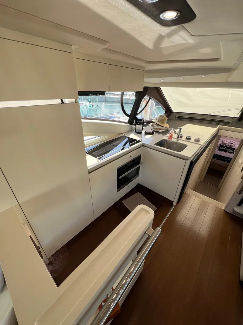 Slide: The Image of 2016 Azimut 54fly yacht kitchen interior with modern appliances and sleek design. - 37