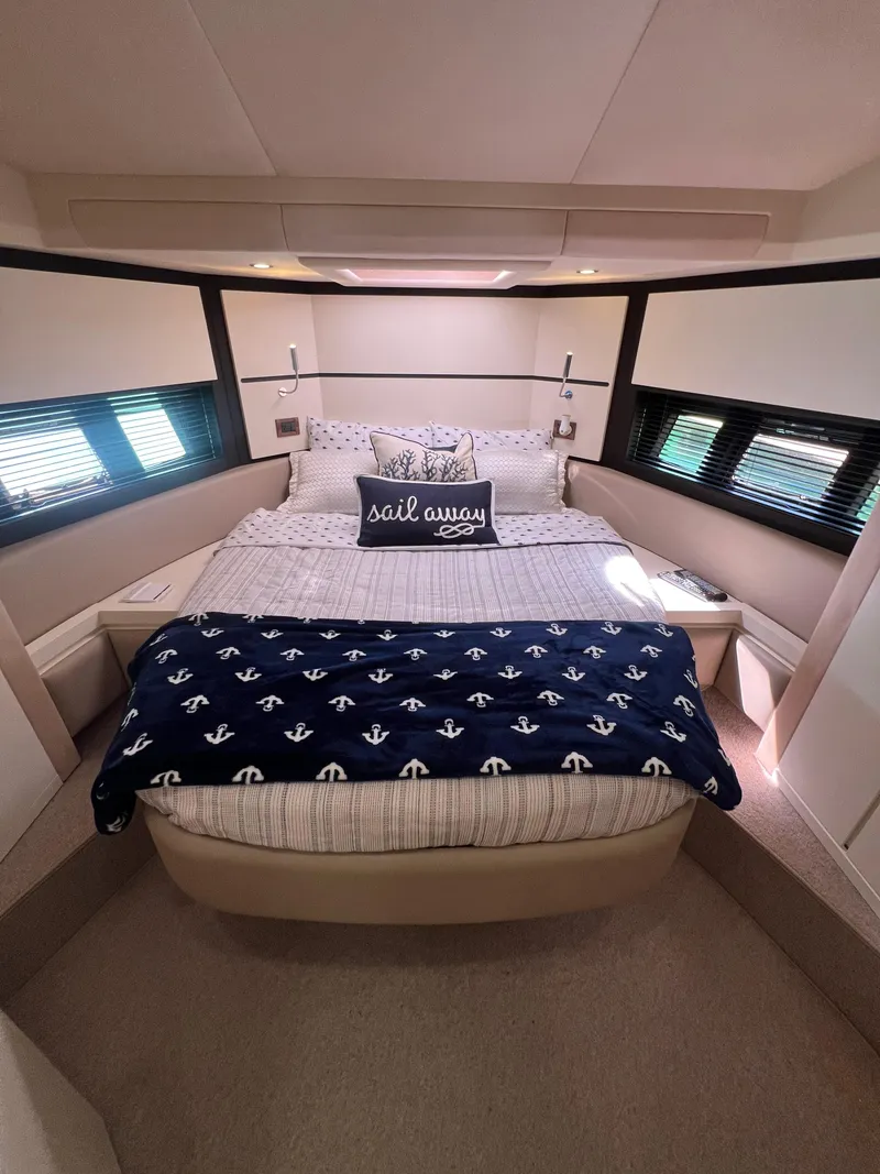 Slide: The Image of Luxurious bedroom in 2016 Azimut 54fly yacht with nautical-themed decor. - 39