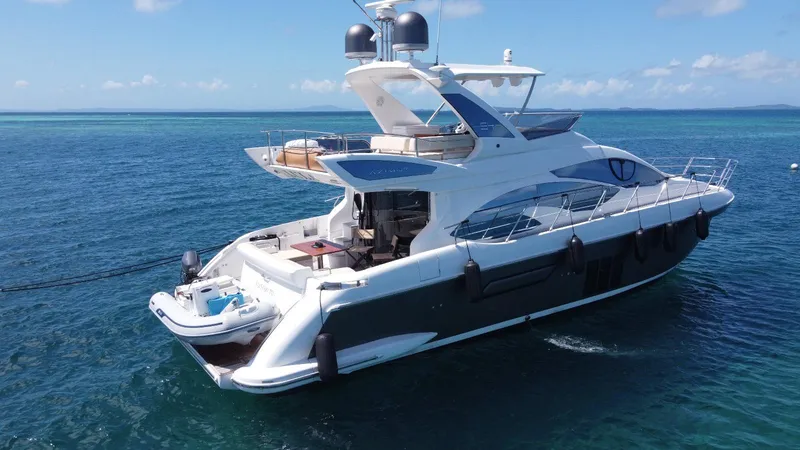 Slide: The Image of Luxury 2016 Azimut 54fly yacht cruising on clear blue ocean waters. - 4