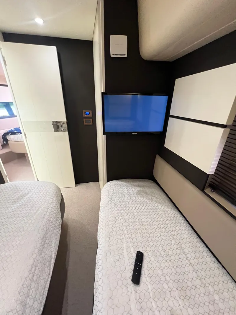 Slide: The Image of Interior of 2016 Azimut 54fly yacht with twin beds and wall-mounted TV. - 42