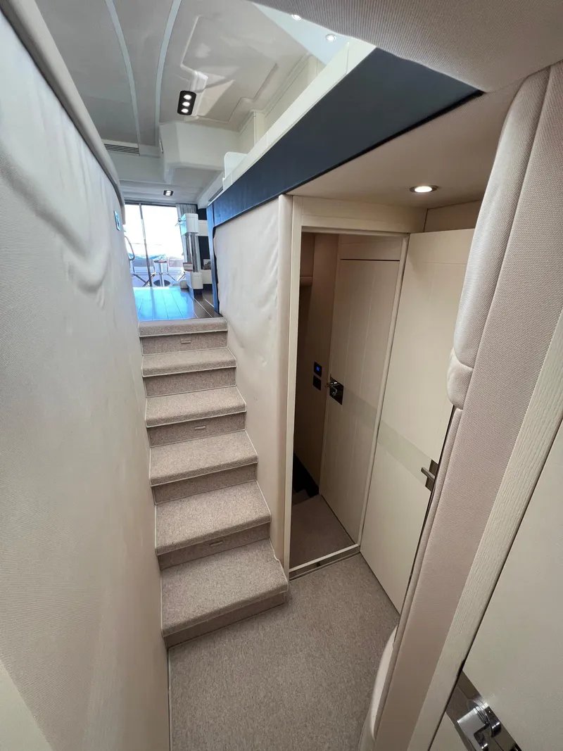 Slide: The Image of Interior of 2016 Azimut 54fly yacht with modern staircase and sleek design. - 44