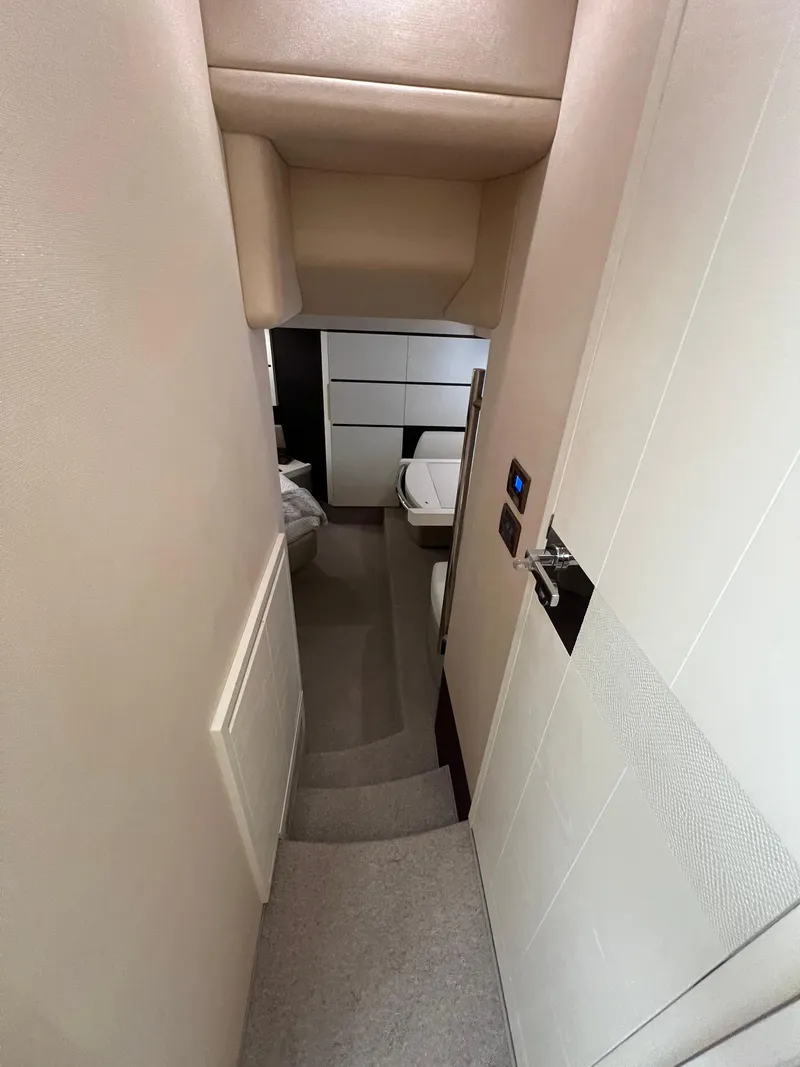 Slide: The Image of Interior hallway of 2016 Azimut 54fly yacht, featuring modern design and neutral tones. - 45