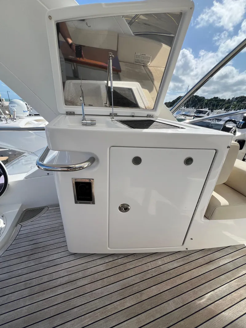 Slide: The Image of 2016 Azimut 54fly yacht deck with sleek cabinetry and modern design. - 8
