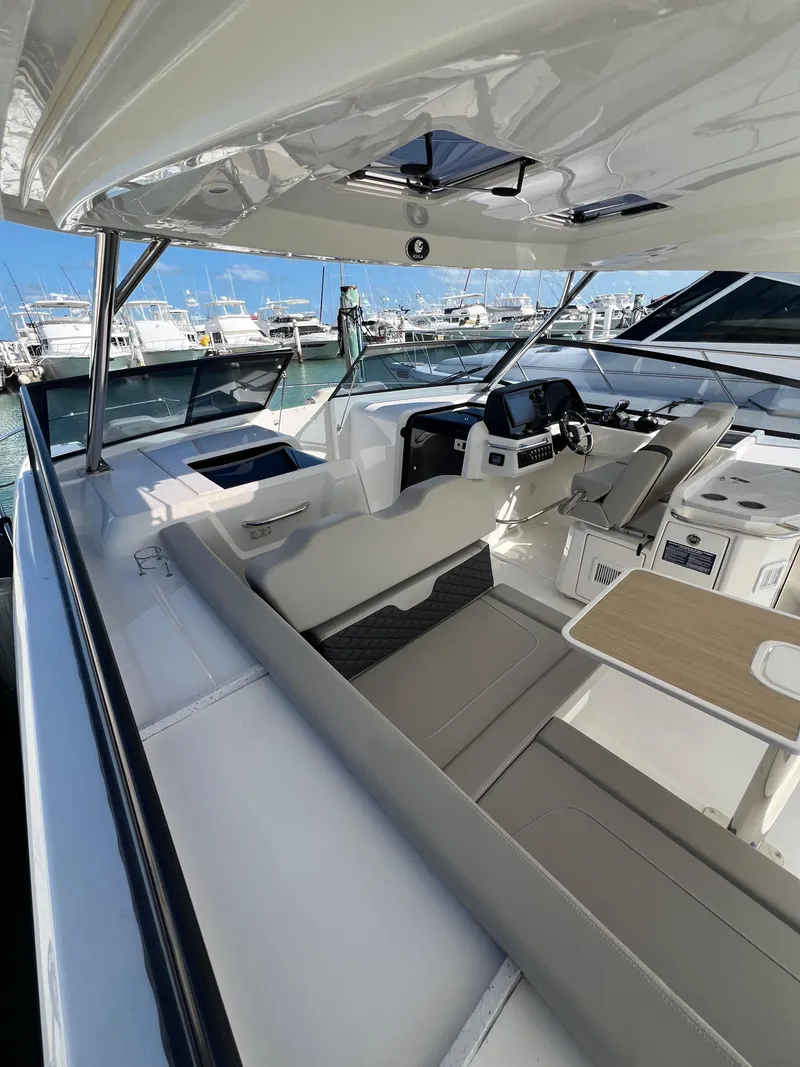 Slide: The Image of 2023 Aquila 36 Sport yacht interior with sleek seating and modern helm. - 18