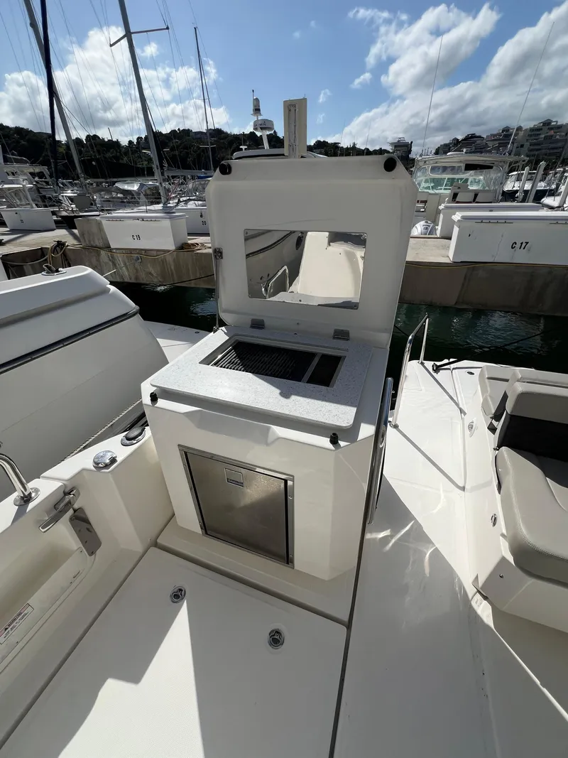 Slide: The Image of 2023 Aquila 36 Sport yacht with open deck kitchen at marina. - 31