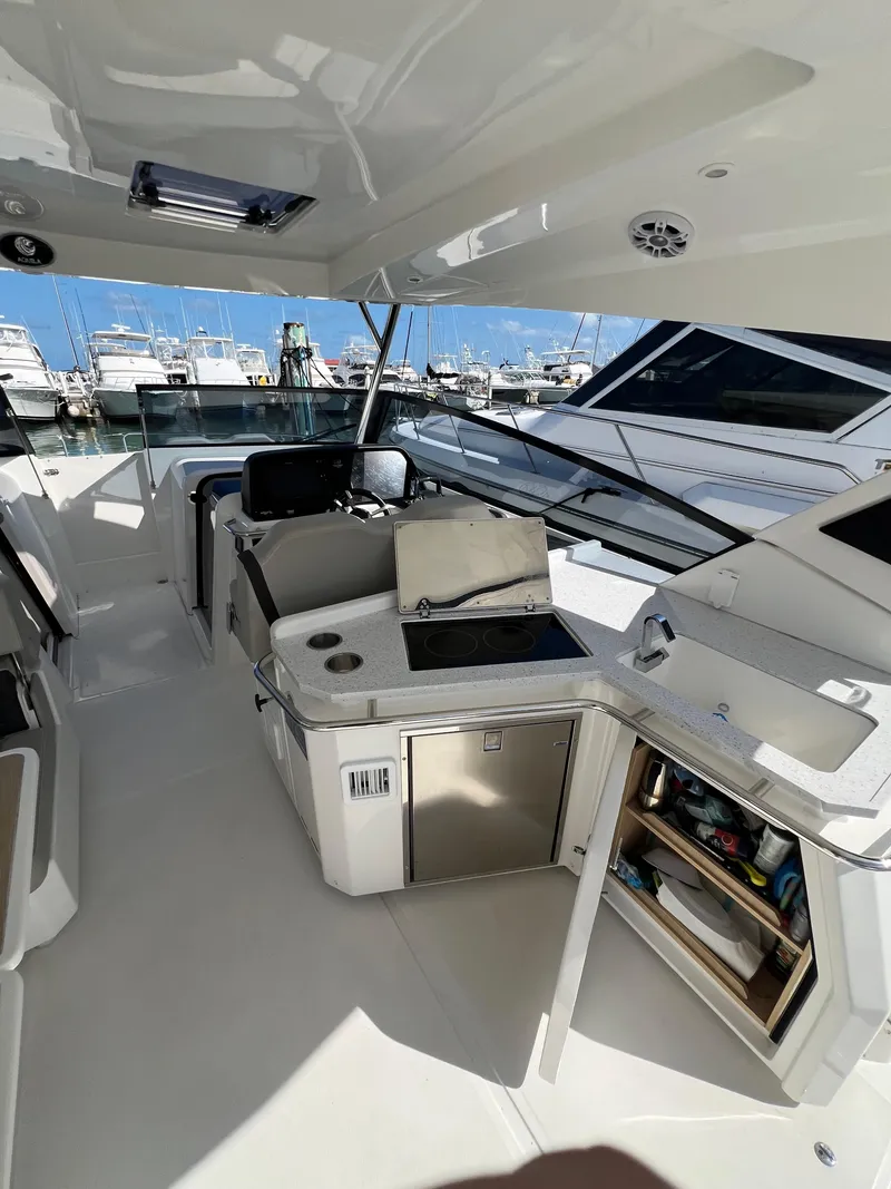Slide: The Image of 2023 Aquila 36 Sport yacht interior with modern amenities and open deck design. - 35
