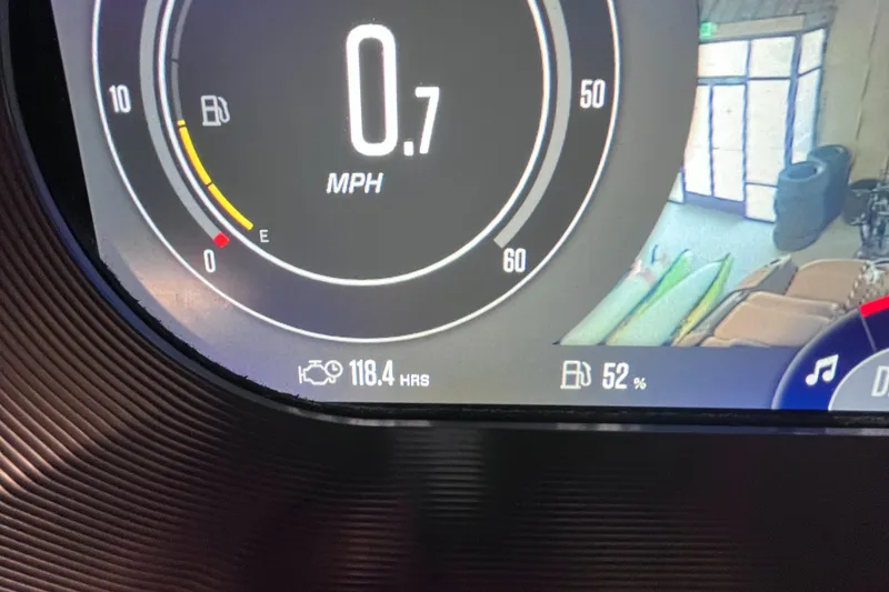 Slide: The Image of Dashboard of 2022 MasterCraft X24 showing 0.7 MPH and 52% fuel. - 11