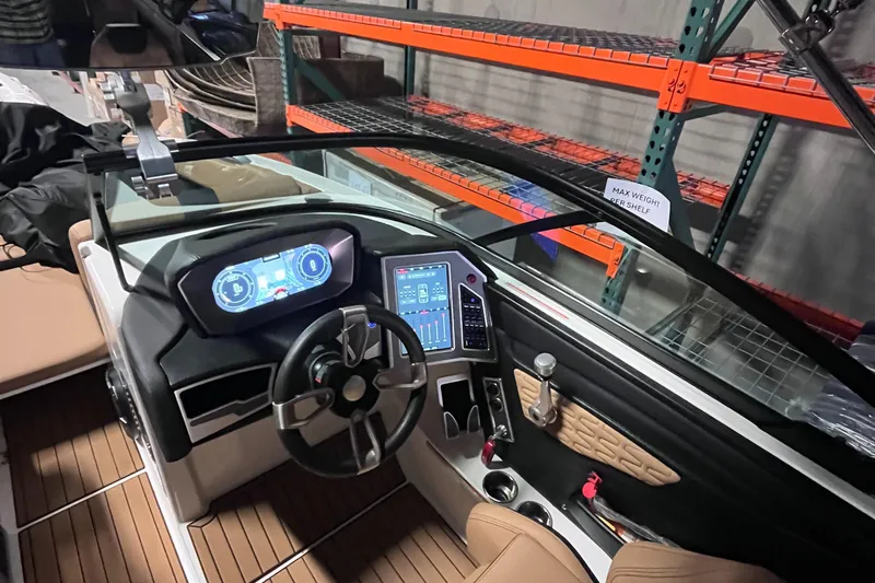 Slide: The Image of 2022 MasterCraft X24 boat dashboard with advanced controls and digital displays. - 13