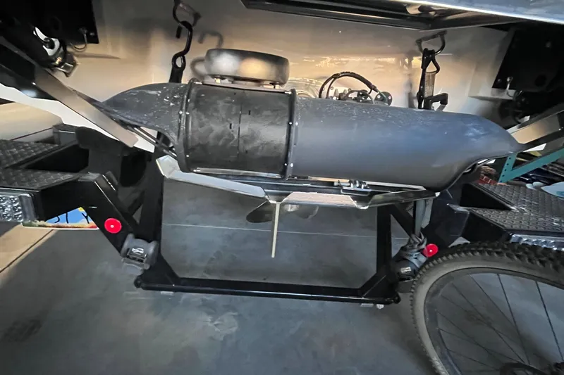 Slide: The Image of 2022 MasterCraft X24 boat trailer with visible undercarriage and components. - 15