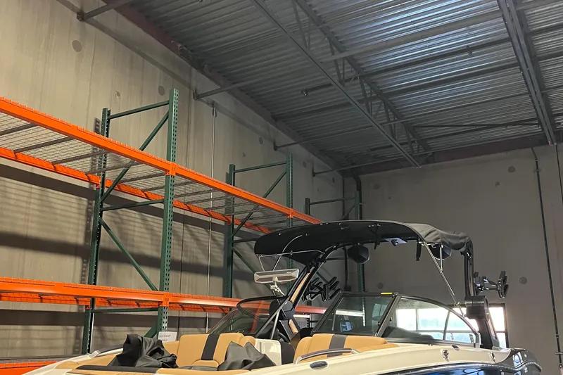 Slide: The Image of 2022 MasterCraft X24 boat in warehouse with empty shelves. - 3