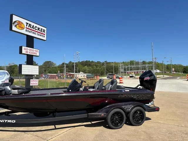 Slide: The Image of 2025 Nitro Z21 XL boat at Tracker Boating Center, parked on a trailer. - 2