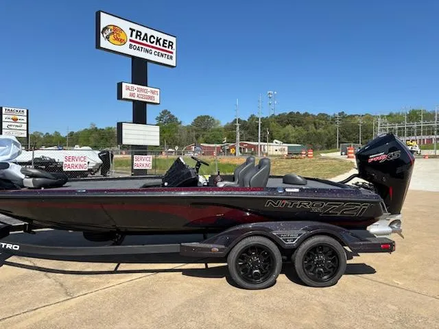 Slide: The Image of 2025 Nitro Z21 XL boat at Tracker Boating Center, parked on a trailer. - 3